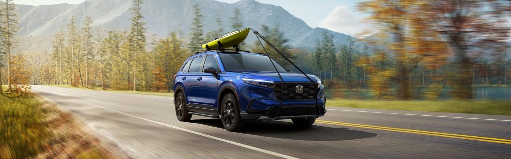 2024 Honda CR-V driving by mountains